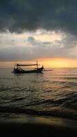Panoramic sunset view at a luxury beach in the tropics, Serene sunset over calm ocean, vertical photo