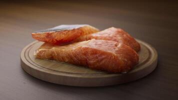Looping animation around a composition of salmon lying on a wooden board. Loop motion. Defocus. Close-up. video