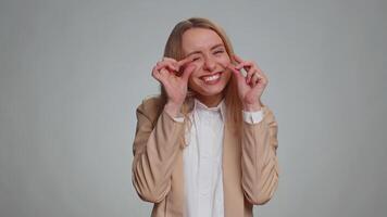 Woman showing a little bit gesture with sceptic smile showing minimum sign, measuring small size video