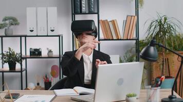 Business woman use virtual reality futuristic technology VR app headset to simulation 3D video