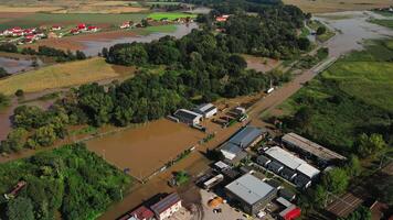 Aerial view of flooded suburban and industrial zone after heavy rain. Concept of infrastructure damage, extreme weather, climate risk and water overflow in rural area video