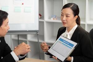 Professional Presentation of Financial Summary. Consultant explaining report. photo
