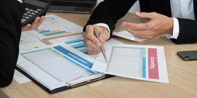 Business Meeting and Financial Reporting. Professionals discussing summary report and accounting data. photo
