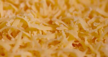 grated cheese preparation for adding to dishes photo