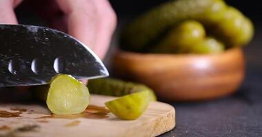 crispy green cucumbers salted with spices photo