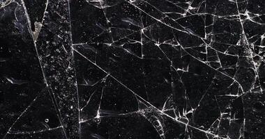 wet thin glass broken into many pieces photo