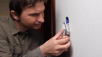 A man is fixing a hole in a wall video