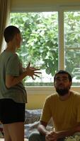 Couple standing face to face in heated argument at home video