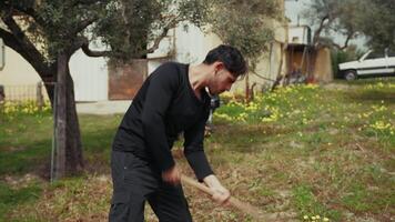 Man Working With Effort Using The Hoe In The Farm video