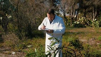 Herborist Writing Datas About The Analysis Of The Plants video