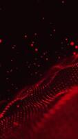 Red glowing circles particles wave at the bottom right and flying in the air on a dark abstract background, bokeh effect, vertical composition. Loop animation footage for graphic design. video