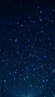 Blue bokeh particles floating in the air on a dark background, vertical composition. Light rays on the bottom. Standard speed. Loop animation footage for graphic design. video