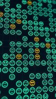 Green glowing emoji icons matrix on a grid abstract background, vertical composition. Bokeh effect. Funny motion graphic. video