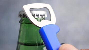 Opening a bottle with a sturdy bottle opener tool video