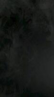 A black background with smoke coming out of it video
