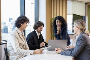 African woman sale manager is showing annual report chart to colleagues in the executive meeting for next year plan with market share increase for global business and investment concept photo