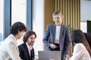 Caucasian woman sale manager is showing the annual report chart to her colleagues in executive meeting for next year plan with market share increase for global business and investment photo
