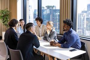 Team of diversity business people are discussing over new strategic strategy project on investment real estate while working inside modern office building for new project and planning photo