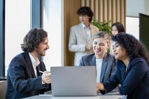 Team of diversity business people discussing over the new strategic strategy project on investment real estate while working in modern office building for new project and planning usage photo