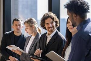 Team of diversity business people discussing over the new strategic strategy project on investment real estate while brainstorming around the office building for new project and planning photo