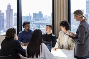 Team of diversity business people discussing over strategic strategy project investment real estate while working in modern office building for project and planning photo