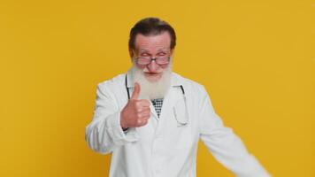 Doctor man raises thumbs up agrees or gives positive reply recommends advertisement likes good idea video
