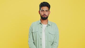 Displeased upset Indian man reacting to unpleasant awful idea, dissatisfied, shake head No, dislike video