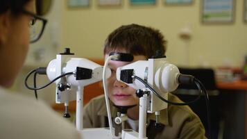 Young boy undergoing comprehensive eye examination with optometrist video