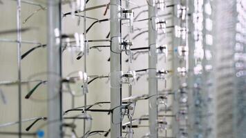 Eyeglasses rotating display stand in an optometrist store video