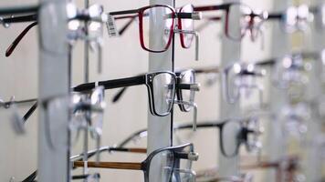 Eyeglasses display stand showing various modern eyeglass frames video