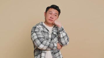 Asian man tired bored expression, exhausted of tedious story, not interested in communication talk video