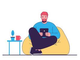 Happy Man Relaxing on Bean Bag Chair Using Tablet vector