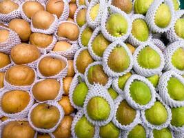 Fragrant Pears, Snow pears in wooden basket for selling in supermarket photo