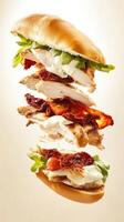 Floating grilled chicken sandwich with fresh mozzarella and sun-dried tomatoes in a dynamic display of ingredients photo