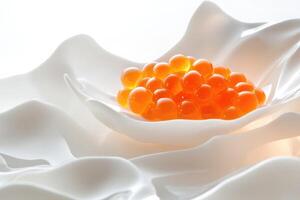 Single pearl of orange Osetra caviar balanced on a porcelain-white ceramic slab with verbena-infused foam photo