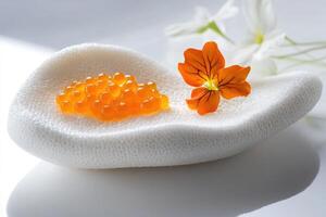 Golden Osetra caviar atop a porcelain slab with verbena foam and orange nasturtium petals in a minimalistic display photo