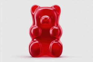 A large red gummy bear is positioned upright, showcasing its glossy surface and familiar features. The candy stands alone, emphasizing its vibrant color and playful design. photo