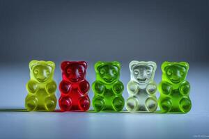 Five gummy bears are displayed in a row, showcasing red, green, and yellow colors. Their cheerful expressions and glossy texture catch the light, creating an enticing and fun visual appeal. photo