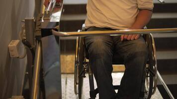 Special elevator for the person with a physical disabilities. A man in a wheelchair uses a special elevator 20 video