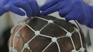 Patient brain testing using encephalography at medical center 40 video