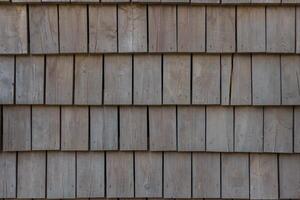 Wall of wooden shingles. Beautiful pattern of squares. photo