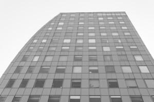 Rows of square windows in a tall modern building. photo