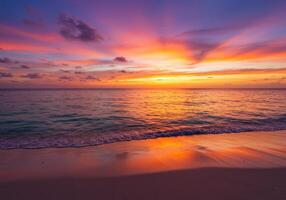 Vibrant sunset over a tranquil tropical beach with colorful sky and ocean reflections photo
