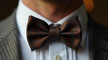 Stylish close-up of a man showcasing a unique patterned bowtie in elegant attire photo