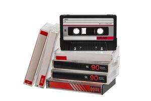 Stack of retro audio cassette tapes with one positioned upright, isolated on white back photo