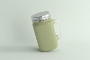 Pastel Green Mason Jar Mug with a Handle and Silver Lid, Leaning on a Soft Green Background photo
