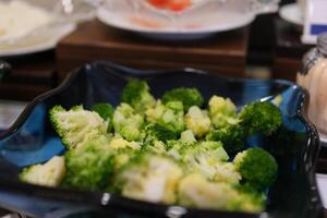 Broccoli, cooking in pan, green vegetables boiling in a pan. Healthy boiled vegetables photo