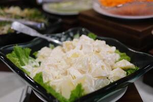 salad with fresh vegetables, potatoes, and creamy dressing. This classic Russian salad offers a perfect mix of boiled veggies, tangy sauce, and rich flavors, ideal for a refreshing meal. photo