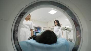 Man Positioned for MRI Scan with Two Technicians Assisting video