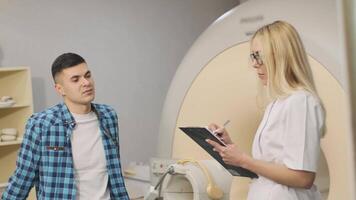 Man Awaiting CT Scan Results in Diagnostic Imaging Room video